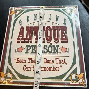 Ande Rooney “Genuine Antique Person” Sign